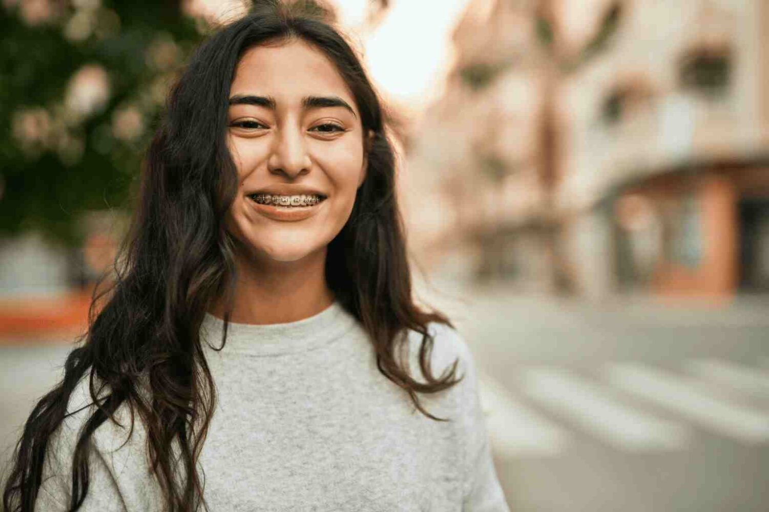 Woman with braces smiling