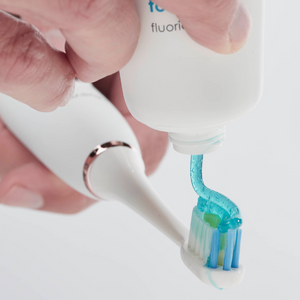 Applying bluem® Toothpaste to bluem® Ultrasonic Toothbrush