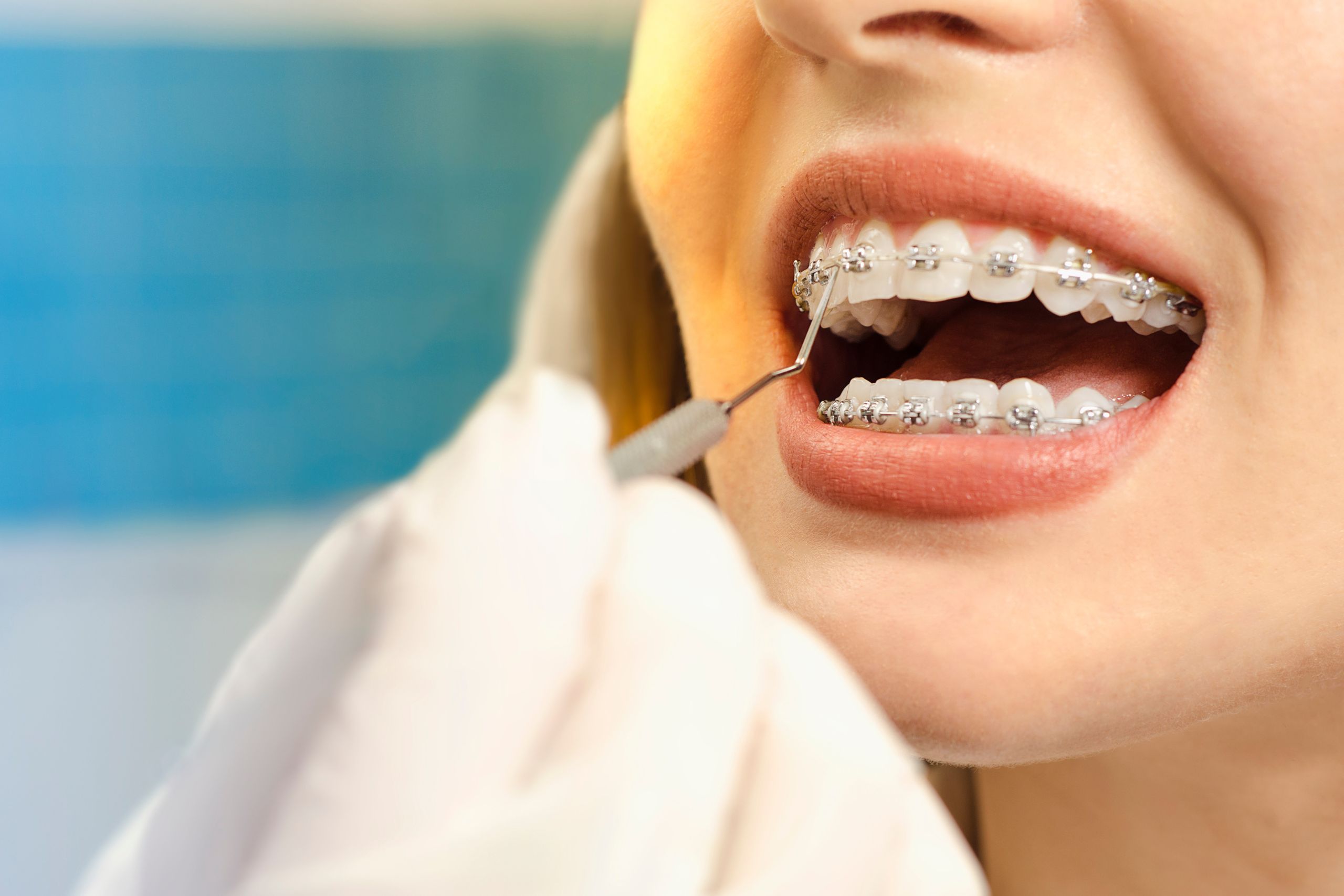 Male dental professional with patient in the chair